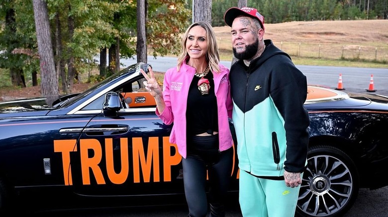 Lara Trump wearing gold Donald Trump necklace and posing with Forgiato Blow