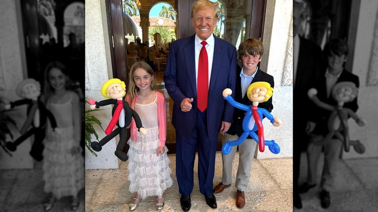 Donald Trump holding hands grandkids