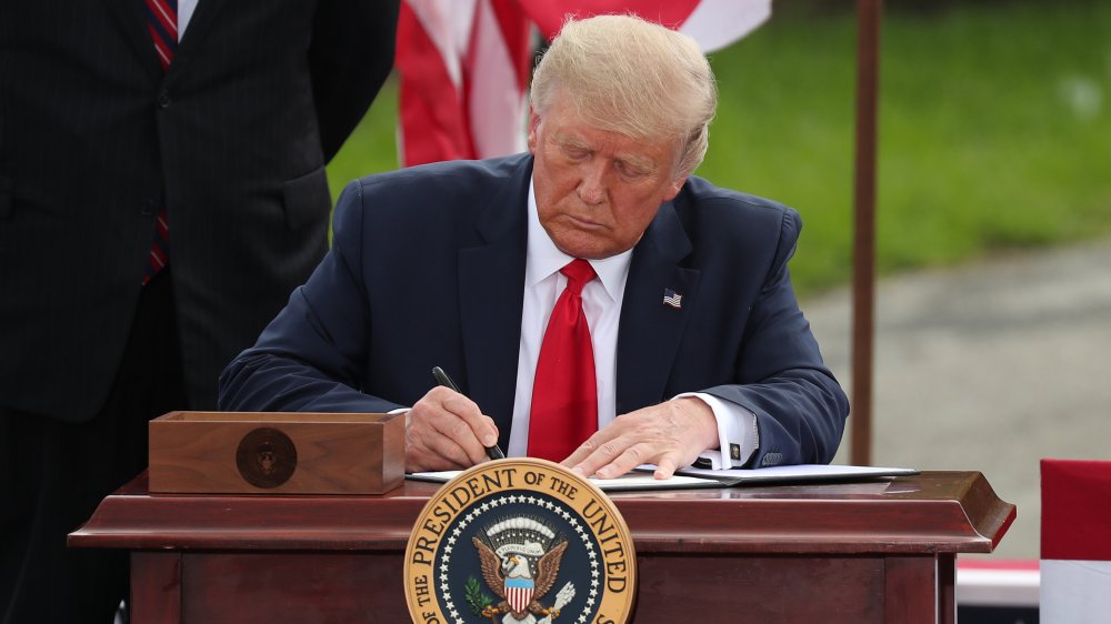 Donald Trump signing documents 