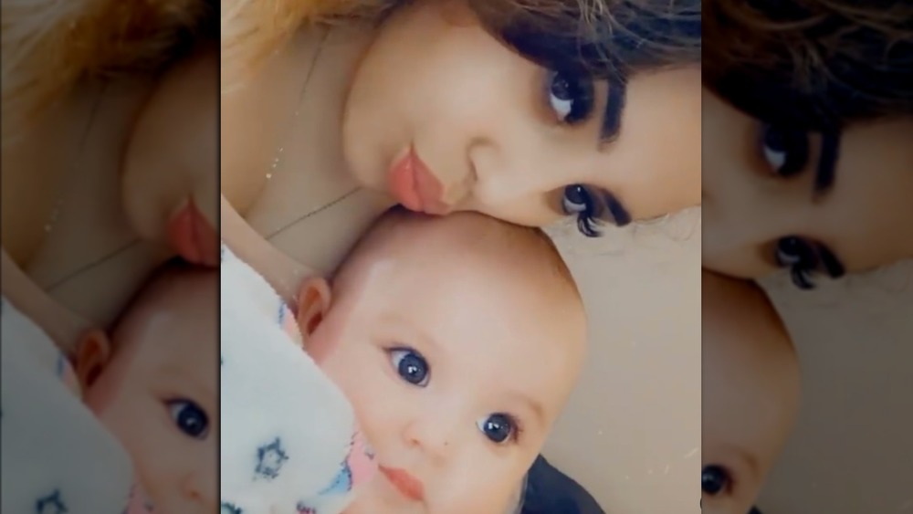 Selena Gutierrez poses with her baby girl Dareli