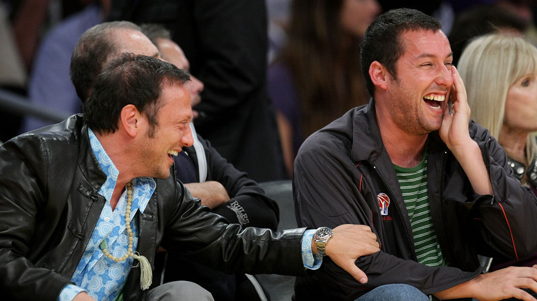 Rob Schneider and Adam Sandler laughing