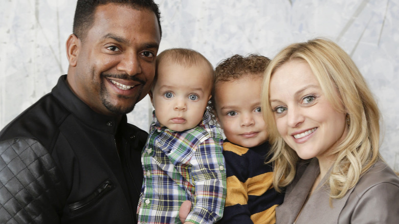 Alfonso Ribeiro and Angela Ulrich smile with their children