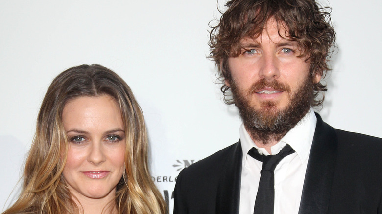 Alicia Silverstone and Christopher Jarecki pose side by side