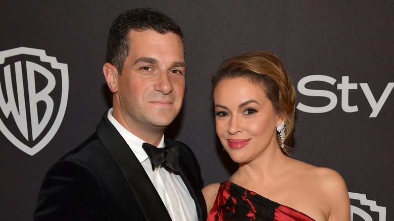 Alyssa Milano and her husband David Bugliari smiling 