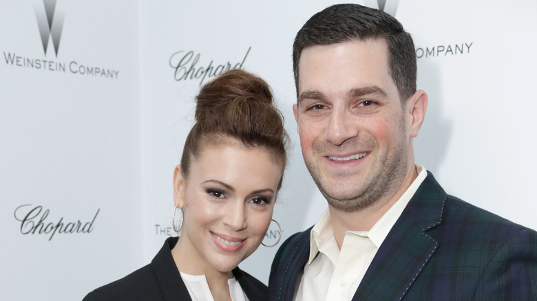 Alyssa Milano and her husband Dave Bugliari smiling