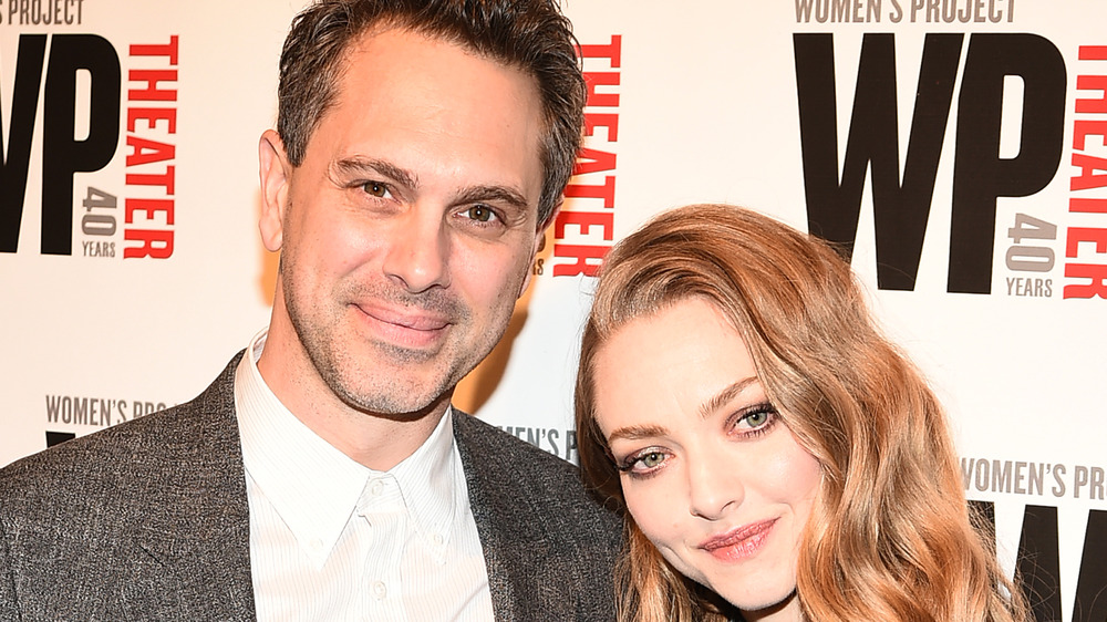 Thomas Sadoski, no facial hair, suit, shorter hair, red carpet; Amanda Seyfried, smiling, dressed up, red carpet