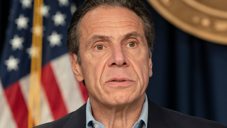 Andrew Cuomo frowns at a press conference