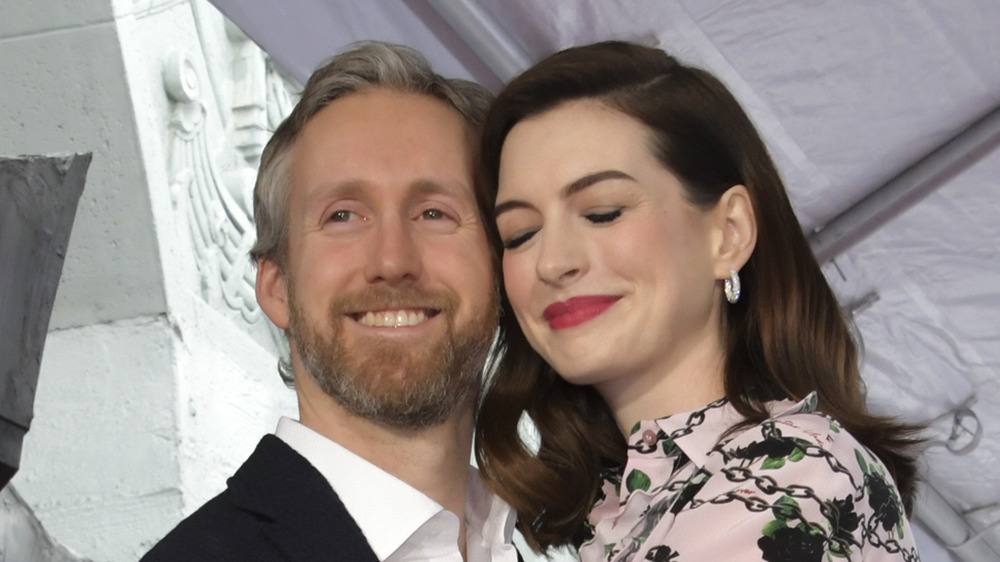 Adam Shulman and Anne Hathaway in an embrace