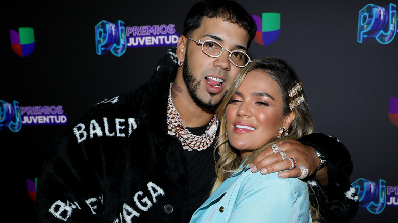 Anuel AA and Karol G embracing on the red carpet