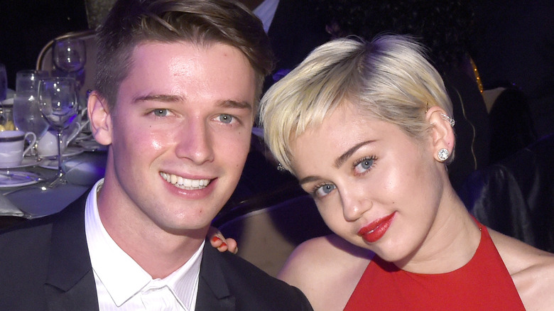 Patrick Schwarzenegger and Miley Cyrus sitting together