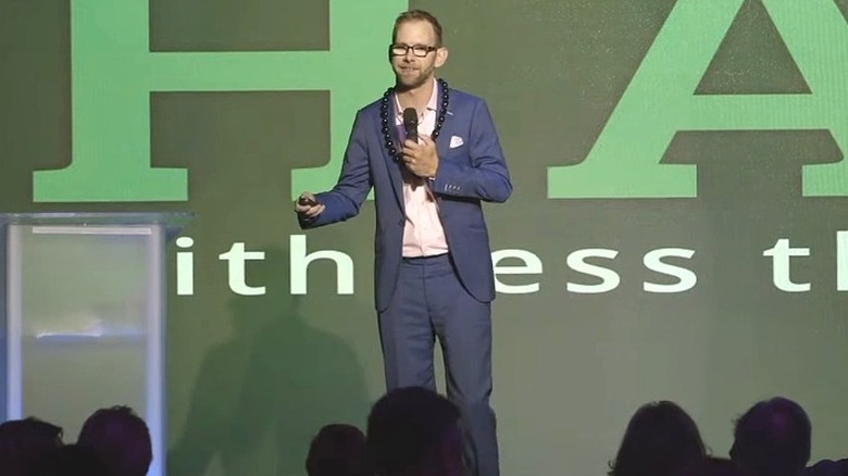 Michael Kutcher speaking to a crowd of people