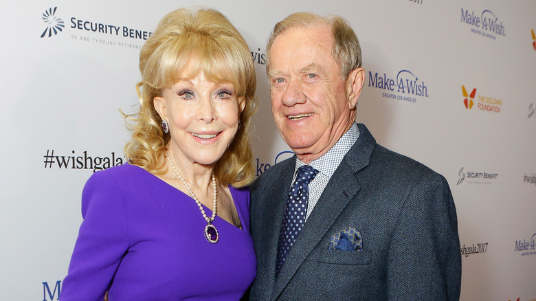 Barbara Eden and her husband Jon Eicholz posing at an event