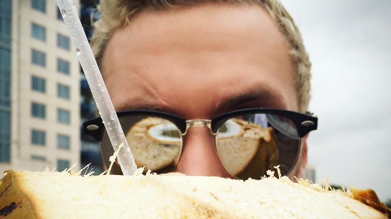 Barron Hilton with coconut