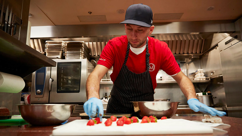 Mathew Shea of Below Deck Med preparing strawberries