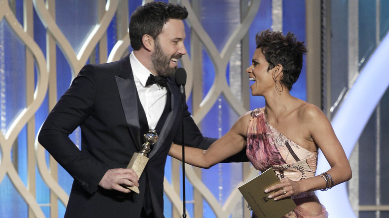 Ben Affleck holding Golden Globe, Halle Berry holding envelope