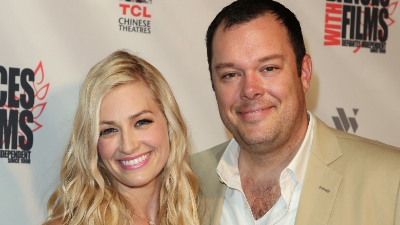 Michael Gladis and Beth Behrs smiling at an event