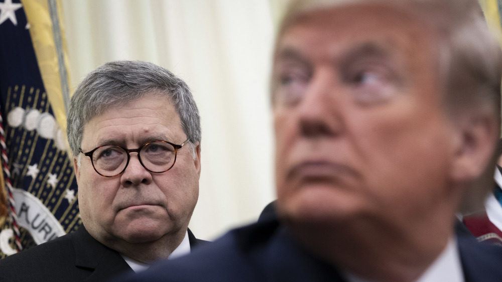 Bill Barr and Donald Trump looking serioua 