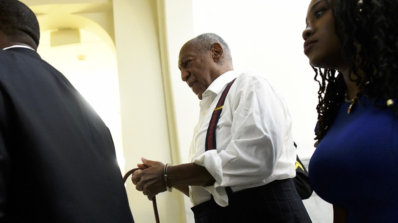 Bill Cosby being taken away in handcuffs