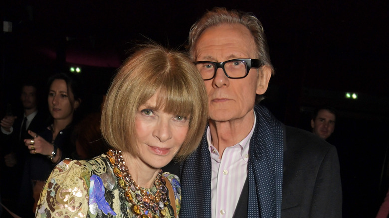 Anna Wintour and Bill Nighy posing at an event 