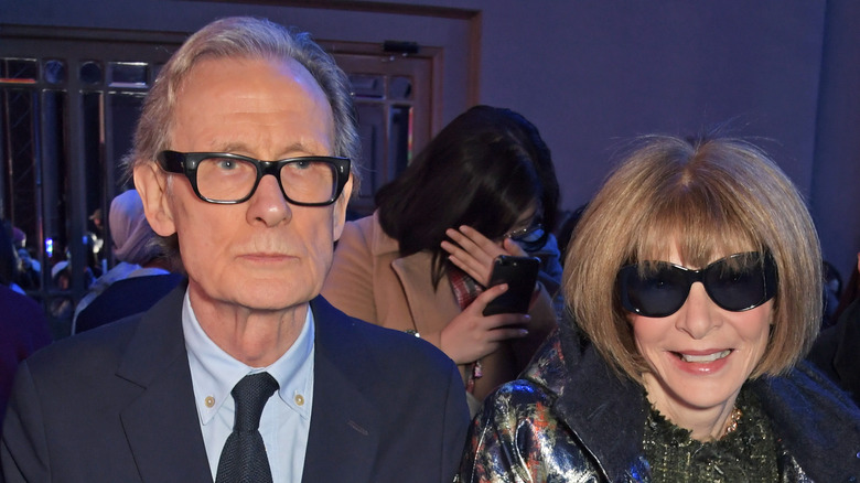 Bill Nighy and Anna Wintour smiling at an event 