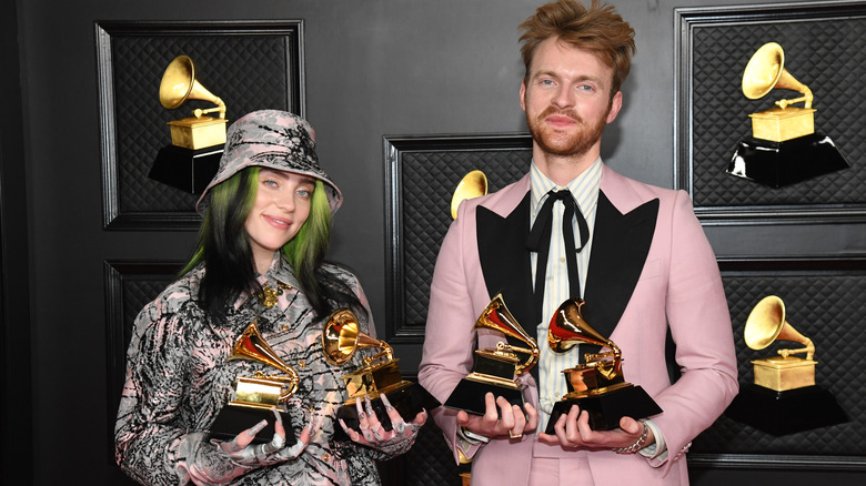 Billie Eilish and Finneas posing with their Grammy Awards