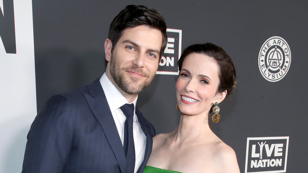 David Giuntoli and Bitsie Tulloch posing together on the red carpet