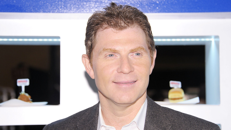 Bobby Flay smiling at an event in 2011