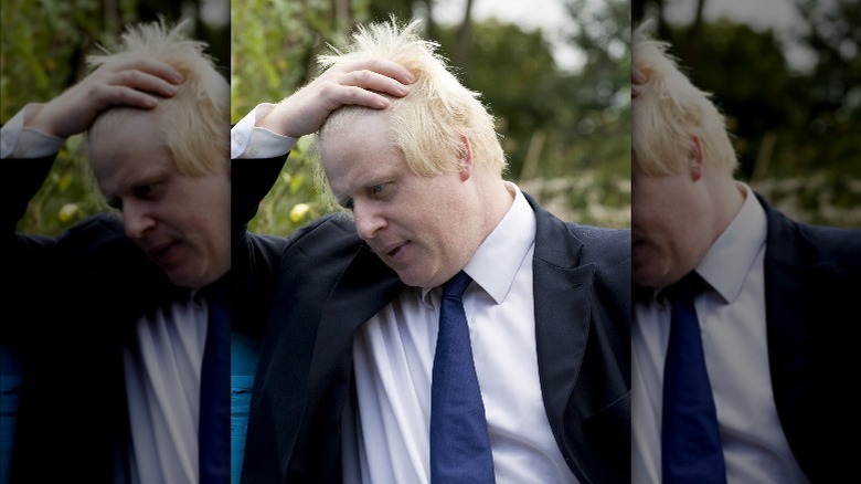 Boris Johnson dishevels his hair 