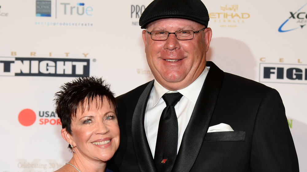 Christine and Bruce Arians smile and pose together on the red carpet