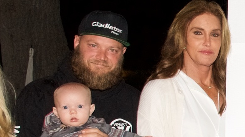 Burt Jenner smiling with Caitlyn and baby