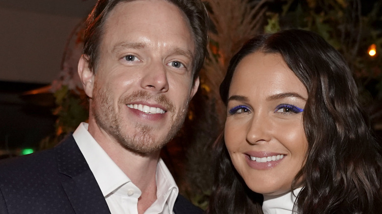 matthew alan and wife camilla luddington smiling for cameras at an event 