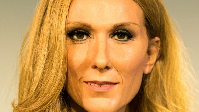 Celine Dion smiles directly to camera