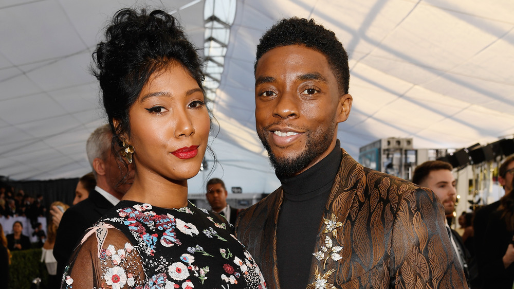 Chadwick Boseman and Taylor Simone Ledward at an event