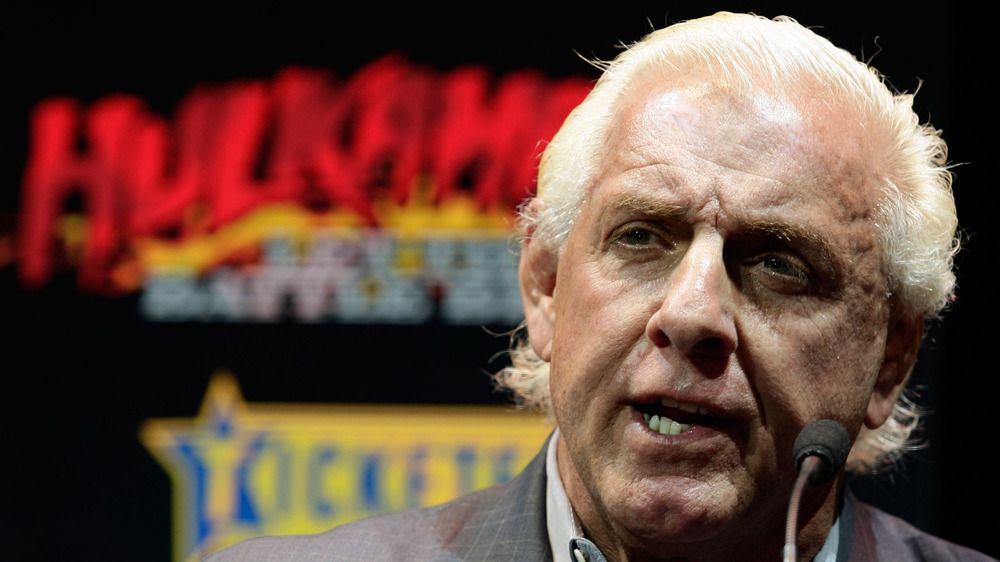 Ric Flair talking into a microphone 