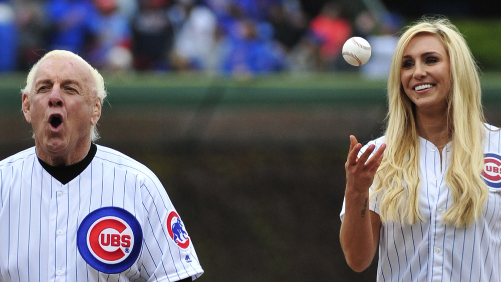 Ric Flair and Charlotte Flair at a baseball game