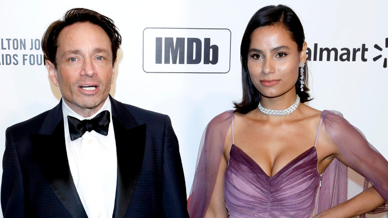 Chris Kattan and Cheyenne Gordon smile on the red carpet