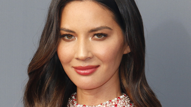 Olivia Munn smiling on the red carpet