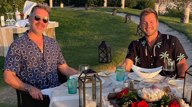 Jordan C. Brown and Colton Underwood smiling over a meal