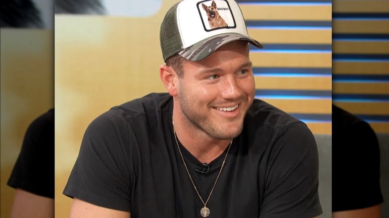 Colton Underwood showing off his engagement necklace