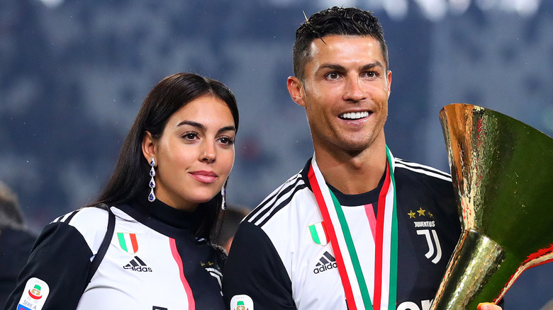 Georgina Rodriguez, Cristiano Ronaldo, smiling