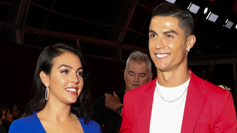 Georgina Rodriguez, Cristiano Ronaldo, smiling