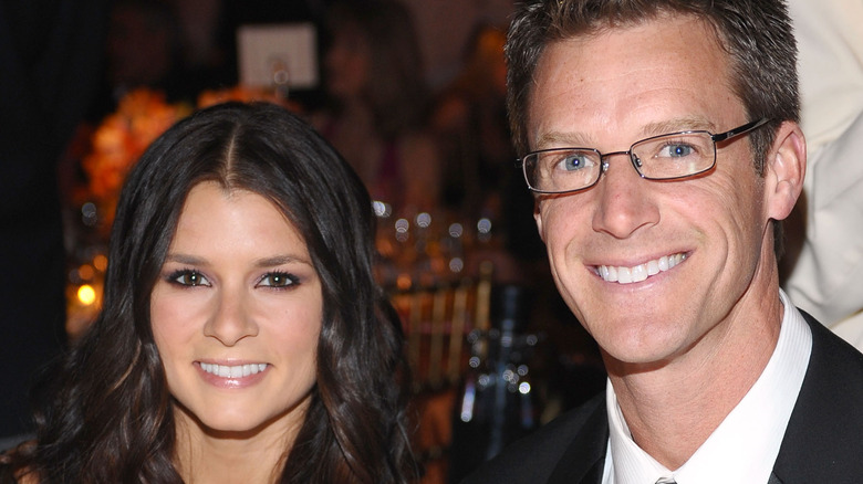 Danica Patrick posing next to Paul Hospenthal in 2009