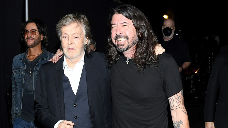 Paul McCartney and Dave Grohl embracing