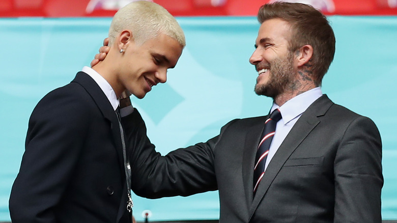 Romeo and David Beckham laughing