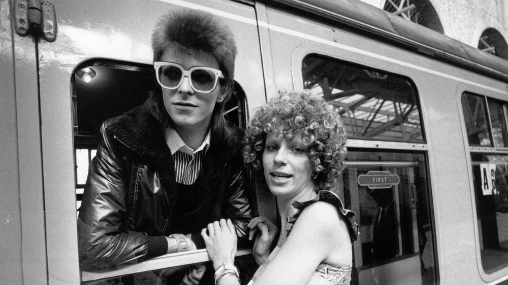 David Bowie and his first wife Angie at a train station