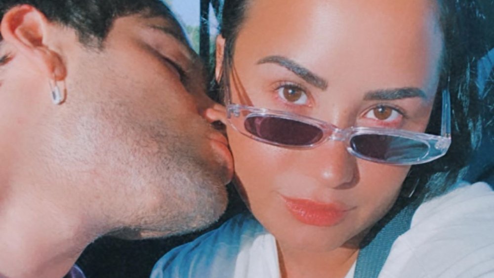 Max Ehrich and Demi Lovato kissing in an Instagram selfie