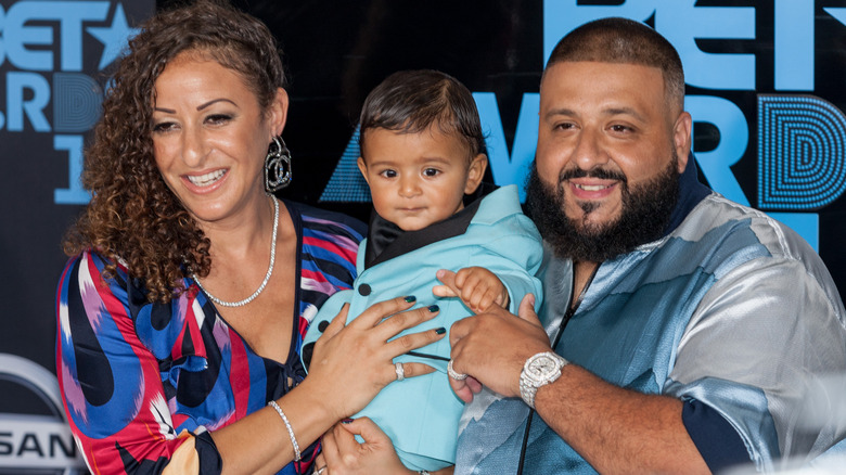 DJ Khaled and Nicole Tuck posing with son Asahd