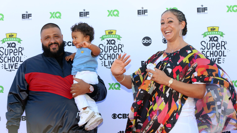 DJ Khaled and Nicole Tuck posing with son Asahd