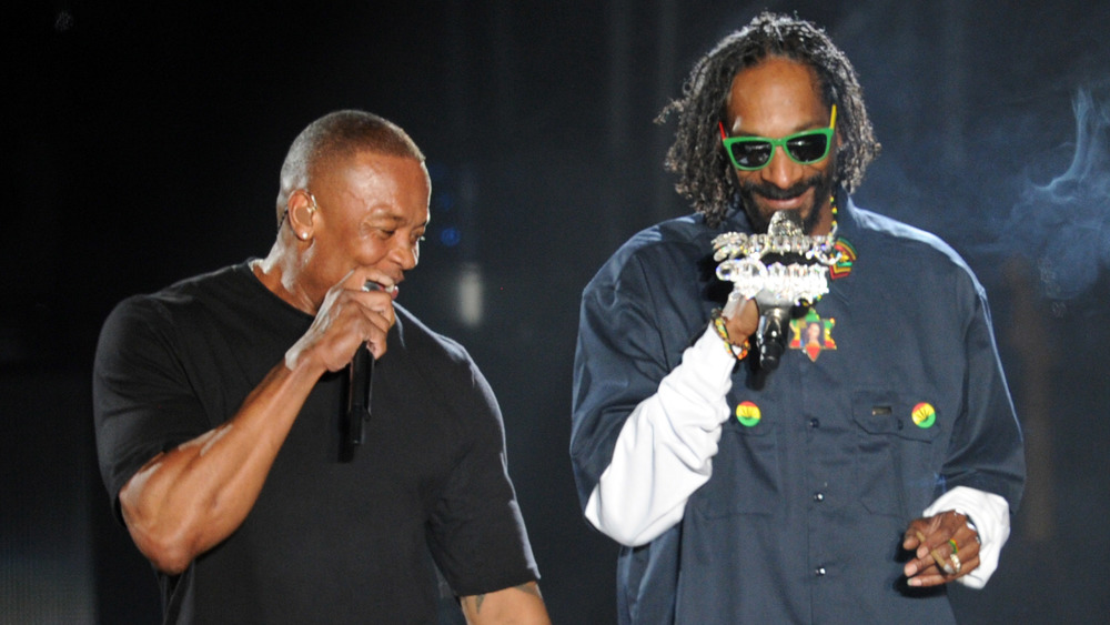 Dr. Dre and Snoop Dogg holding microphones