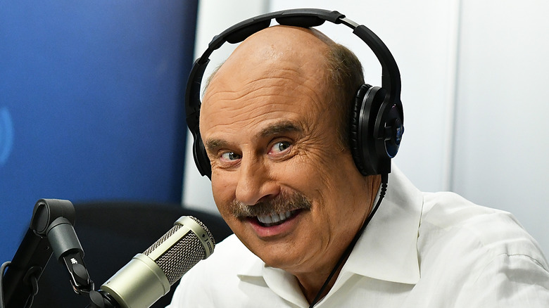 Dr Phil grinning headphones microphone